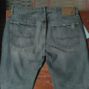 American Eagle light blue rip/fade design